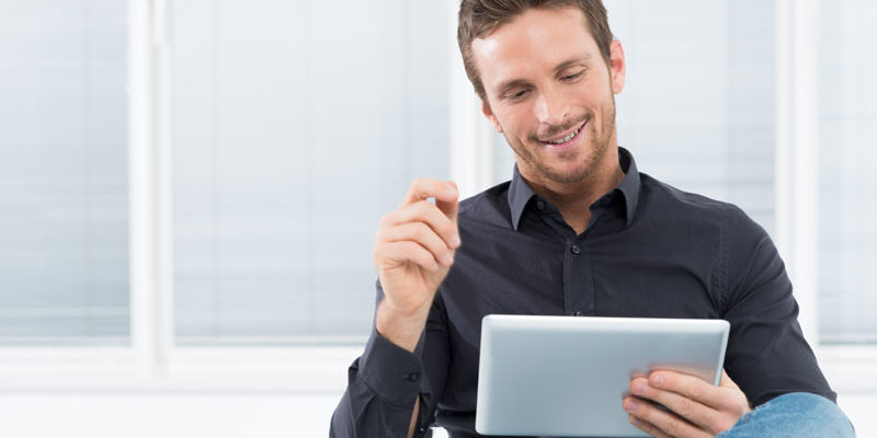 Young Man Using Digital Tablet